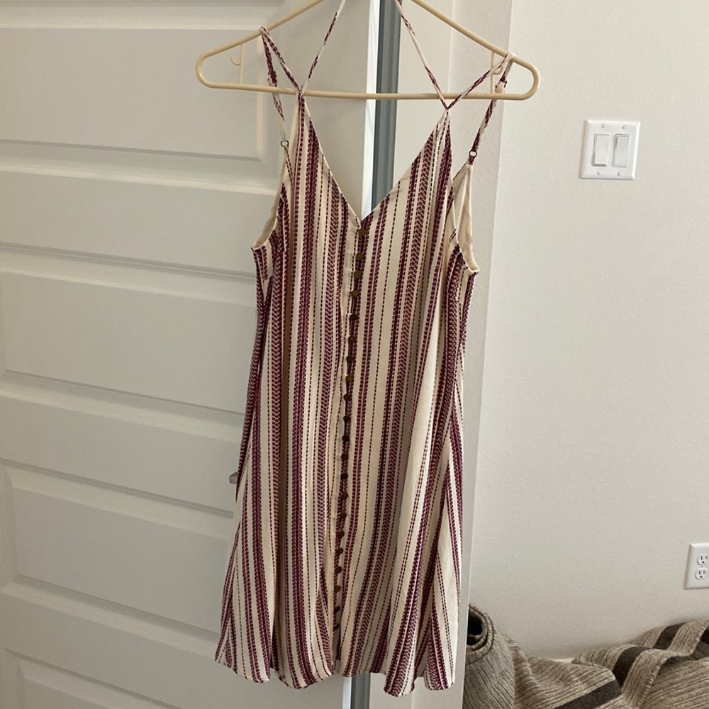 En creme dress with vertical stripes